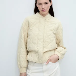 Elegant Cream Quilted Bomber Jacket – Luxe Texture and Classic Ribbed Hem