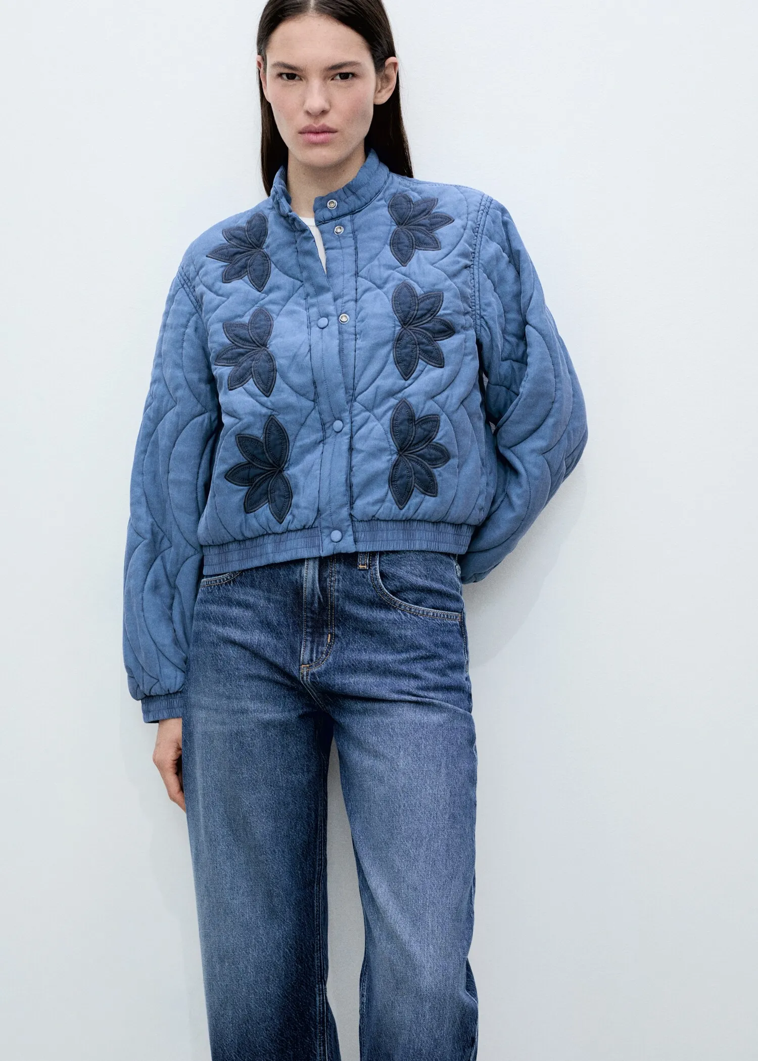 Chic Blue Quilted Bomber Jacket with Contrast Flower Appliqué