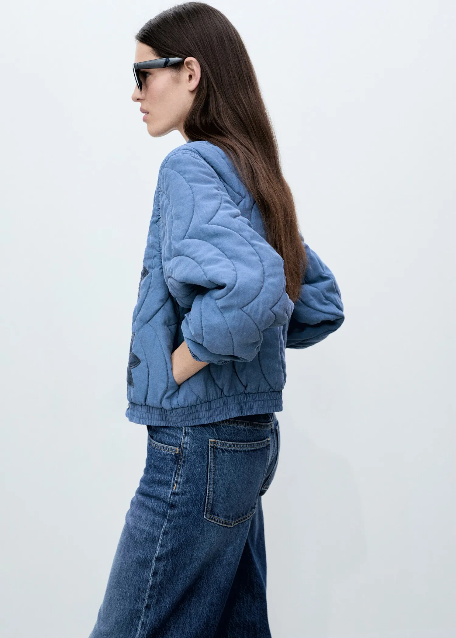 Chic Blue Quilted Bomber Jacket with Contrast Flower Appliqué - Image 2